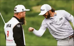  ?? Nick Wass / Associated Press ?? Max Homa celebrates with his caddie after winning the Wells Fargo Championsh­ip on Sunday at TPC Potomac at Avenel Farm golf club in Potomac, Md.