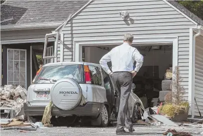  ?? STAFF FILE PHOTOS BY MARK GARFINKEL ?? ‘DEEP, DEEP PAIN’: Gov. Charlie Baker tours a home on Chickering Street, also below, in Lawrence the day after gas explosions earlier this month. The family who lived in the home is suing Columbia Gas for ‘gross negligence.’