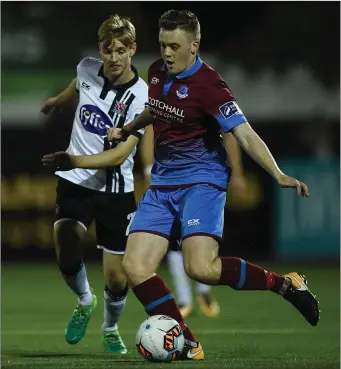  ??  ?? Drogheda United’s Richie Purdy takes on Steven Kinsella of Dundalk.