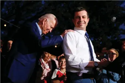  ?? Photograph: Elizabeth Frantz/Reuters ?? Pete Buttigieg with Joe Biden on Super Tuesday in March. Buttigieg dropped out of the presidenti­al race to endorse Biden.