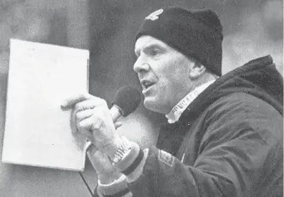  ?? ROB BURNS/AP ?? Bengals coach Sam Wyche speaks over the public address system Dec. 10, 1989, to appeal to fans after several snowballs were thrown on the field in the fourth quarter.