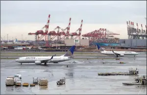  ?? AP/JULIO CORTEZ ?? United Airlines jets are shown last week at Newark Liberty Internatio­nal Airport in Newark, N.J. The airline on Monday reported a $96 million first-quarter profit, a sharp drop from a year ago.