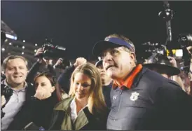  ?? The Associated Press ?? DIVISION CHAMPS: Auburn head coach Gus Malzahn talks to media on the field on Nov. 25, 2017, after winning the Iron Bowl against Alabama in Auburn, Ala.