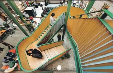  ?? Jackal Pan Visual China Group via Getty Images ?? WEWORK plans to pull back from China and other regions. Above, a WeWork co-working space in Shanghai.