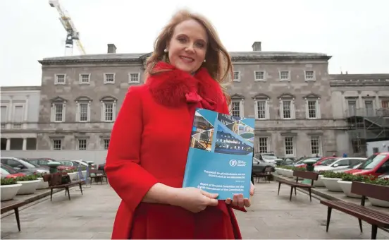  ??  ?? Senator Catherine Noone, chairperso­n of the Joint Committee on the Eighth Amendment, with the report outlining the decisions taken by the Oireachtas committee, at Leinster House, Dublin. Photo: Gareth Chaney/Collins