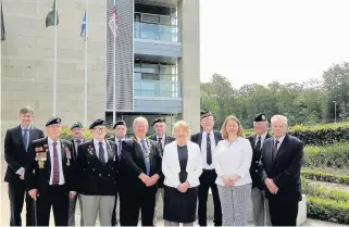  ??  ?? Flag raising Provost Tom Kerr and Lord Lieutenant Isobel Brydie with veterans