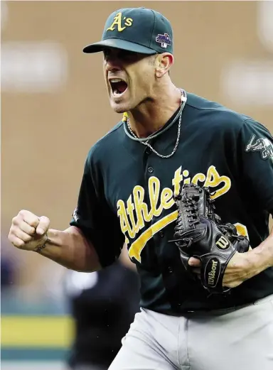  ?? LeON HALIP / GeTTy IMAGeS ?? Oakland’s Grant Balfour, pictured, and Detroit’s Victor Martinez exchanged words in the ninth. After order was restored, Balfour completed a hitless inning to record his first save of the series. “It’s competitio­n,” Oakland’s Brandon Moss said....