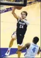  ?? Denis Poroy Associated Press ?? GONZAGA forward Corey Kispert goes up for a dunk over San Diego forward Josh Parrish.