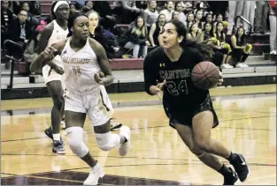  ??  ?? (Below) Gabby Sanchez (24) drives the ball to the hoop while Jasmine Hardy (11) tries to stop her.