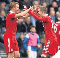  ??  ?? Adam Rooney (left) with James Maddison.