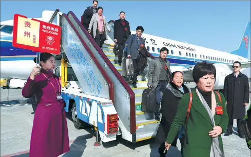  ?? CHEN YEHUA / XINHUA ?? The Guizhou provincial delegation for the Fifth Session of the 12th National People’s Congress, China’s top legislatur­e, arrives in Beijing on Thursday. The session is scheduled to begin on Sunday.