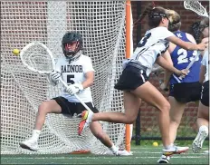  ?? PETE BANNAN - MEDIANEWS GROUP ?? Radnor goalkeeper Arden Jansen, left, makes a save on Kennett’s Jordyn MacMillan Thursday in a District 1 Class 3A girls lacrosse playoff game.