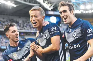  ??  ?? Victory players celebrates Keisuke Honda’s opening goal on Saturday. Picture: GETTY IMAGES