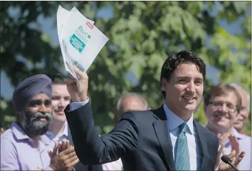  ?? — THE CANADIAN PRESS ?? Liberal Leader Justin Trudeau unveiled his environmen­tal platform at Jericho Beach in Vancouver Monday, saying he would hold the provinces to carbon pollution reductions if he becomes Canada’s next prime minister.