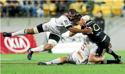  ?? PHOTO: GETTY IMAGES ?? Michael Leitch, here tackling Beauden Barrett, was big for the Chiefs in their last meeting with the Hurricanes and he has recovered from a broken thumb to be named on the bench for tomorrow night’s semifinal.