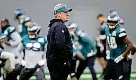  ?? [AP PHOTO] ?? Philadelph­ia Eagles head coach Doug Pederson watches practice at the team’s NFL football facility on Wednesday in Philadelph­ia. The Eagles host the Minnesota Vikings on Sunday for the NFC Championsh­ip.