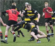  ?? ?? Fergus MacIntyre dives into a tackle while team captain Hamish Kennedy closes in.