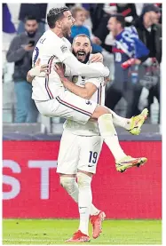  ?? REUTERS ?? France’s Theo Hernandez, left, celebrates his goal against Belgium with Karim Benzema.
