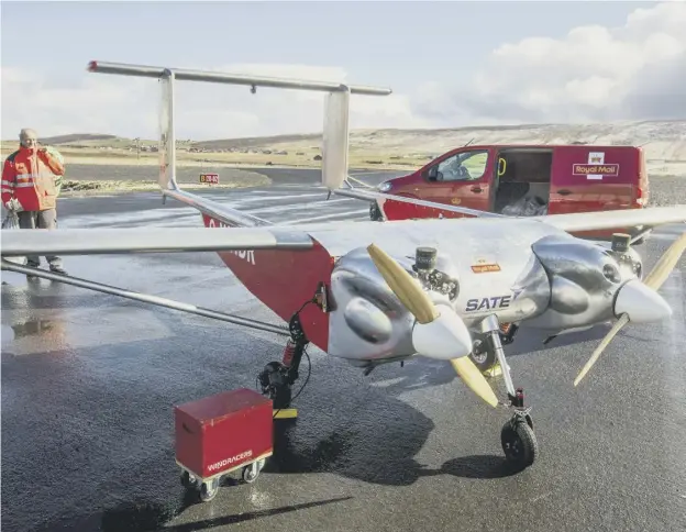  ?? ?? 0 The UAV being loaded with mail before the flight to Unst