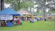  ??  ?? Vendors were setup in Seaborn Jones Park for the first evening of Homespun 2019, which was gospel night for the annual event.