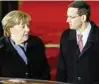  ??  ?? Premier Morawiecki und Kanzlerin Merkel. Foto: rtr