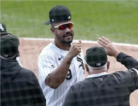  ?? ap ?? MOVING ON: Jose Abreu celebrates after the White Sox beat the Twins, 4-3. Abreu had a home run and drove in two to help Chicago clinch its first playoff berth since 2008.