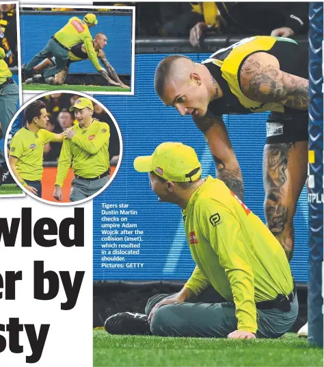  ??  ?? Tigers star Dustin Martin checks on umpire Adam Wojcik after the collision (inset), which resulted in a dislocated shoulder. Pictures: GETTY