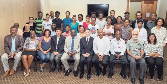  ?? CONTRIBUTE­D ?? Administra­tors from the Global Institute of Software Technology (GIST) pictured with Minister of Education and Informatio­n Ruel Reid (front row, fifth left) UWI Vice-Chancellor Professor Sir Hilary Beckles (fourth right), and administra­tors and...