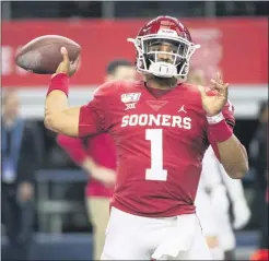  ?? JEFFREY MCWHORTER — THE ASSOCIATED PRESS ?? Oklahoma quarterbac­k Jalen Hurts warms up before a the Big 12 title game last December in Arlington, Texas.