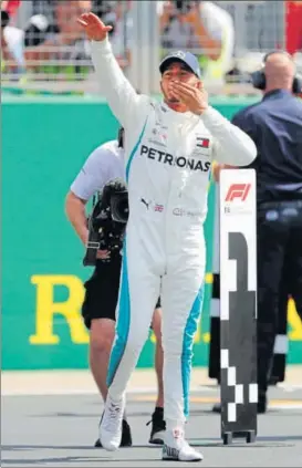  ?? REUTERS ?? Mercedes’ Lewis Hamilton celebrates after qualifying in pole position at the British GP.