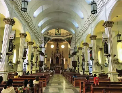  ??  ?? ALL-FEMALE SAINTS line the aisle pillars of St. Anne Parish Church in Molo.