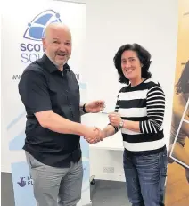  ??  ?? Award Jane was named Scottish Squash Coach of the Year in 2019. She received her award from Scottish Squash president Mark Adderley