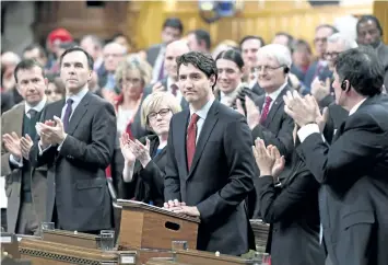  ?? JUSTIN TANG/ THE CANADIAN PRESS ?? Prime Minister Justin Trudeau is applauded as he rises to deliver a speech on the recognitio­n and implementa­tion of Indigenous rights in the House of Commons on Parliament Hill in Ottawa on Wednesday.