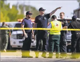  ?? NICK WAGNER — AUSTIN AMERICAN-STATESMAN ?? Law enforcemen­t officials work the scene Sunday of a fatal shooting at the First Baptist Church in Sutherland Springs, Texas. Twenty-six people died in the attack.