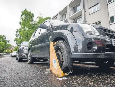  ?? Picture: Steve MacDougall. ?? A car in Hay Street, Perth, has been clamped in the two-week crackdown.