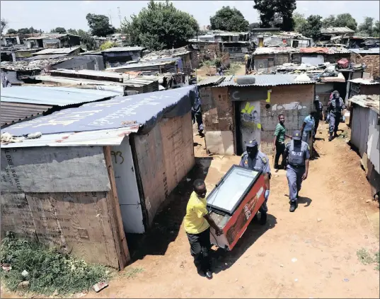  ?? PICTURE: CHRIS COLLINGRID­GE ?? MUSHROOMIN­G: This file image taken in 2015 of the squatter camp in Crown Mines, to which businesses are objecting.