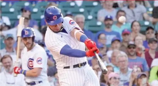  ?? CHARLES REX ARBOGAST/AP ?? The Cubs’ Willson Contreras launches a solo home run in the first inning Tuesday against the Padres. He added a two-run homer in the third.