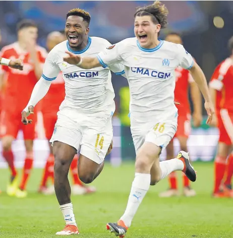 ?? Picture: REUTERS ?? Olympique de Marseille’s Pierre-Emerick Aubameyang and Faris Moumbagna celebrate winning the penalty shootout.