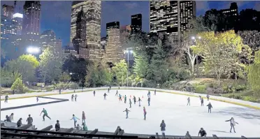  ?? MARK LENNIHAN / AP ?? Skaters take to the ice at Wollman Rink in New York's Central Park in November 2016. New York City will terminate business contracts with President Donald Trump after last week's insurrecti­on at the U.S. Capitol, Mayor Bill de Blasio announced Wednesday, including two ice rinks, a carousel in Central Park and a a golf course in the Bronx.