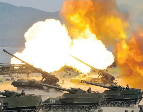  ?? STR/AFP/ GETTY IMAGES ?? North Korea conducted live-fire artillery drills on Tuesday, to celebrate the 85th anniversar­y of the founding of the Korean People’s Army. On the same day, a U. S. guided-missile submarine docked in South Korea.