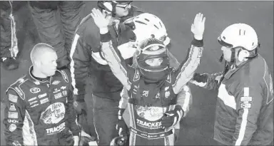  ?? DAVID GRAHAM/AP ?? Austin Dillon lets the Daytona crowd know he is OK after a horrific wreck at the end of the Coke Zero 400.