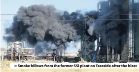  ??  ?? > Smoke billows from the former SSI plant on Teesside after the blast