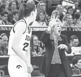  ?? LILY SMITH/THE REGISTER ?? Iowa head coach Lisa Bluder, right, and the Hawkeye roster (including Caitlin Clark, left) bring a wide range of experience to the NCAA Tournament.