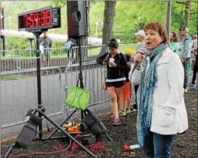  ?? PHOTOS BY LAUREN HALLIGAN — LHALLIGAN@DIGITALFIR­STMEDIA.COM ?? Elizabeth Sobol, president and CEO of Saratoga Performing Arts Center speaking to participan­ts at the eighth annual Rock & Run fundraiser on Sunday in the Saratoga Spa State Park.