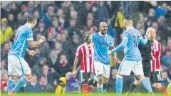  ?? AP ?? City’s Fabian Delph, centre, celebrates scoring against Southampto­n.