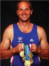  ??  ?? Sir Steve Redgrave holds his many gold medals