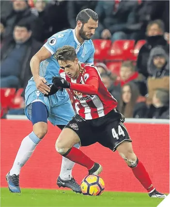  ??  ?? Erik Pieters of Stoke City and Adnan Januzaj of Sunderland battle for possession.