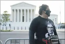  ?? PATRICK SEMANSKY — THE ASSOCIATED PRESS ?? Kara Stewart of Martin, Ky., stands outside the Supreme Court in Washington on Wednesday, before a private ceremony and public viewing of Justice Ruth Bader Ginsburg.