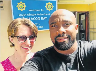  ?? Picture: SUPPLIED ?? SCAM BUSTERS: Gonubie resident Pippa Hamilton and Taxify driver Mfundo Magwaca outside the Beacon Bay police station.