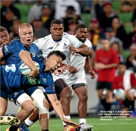  ?? GETTY IMAGES ?? Blues wing A J Lam goes over for his second try last night against the Fijian Drua in Melbourne.